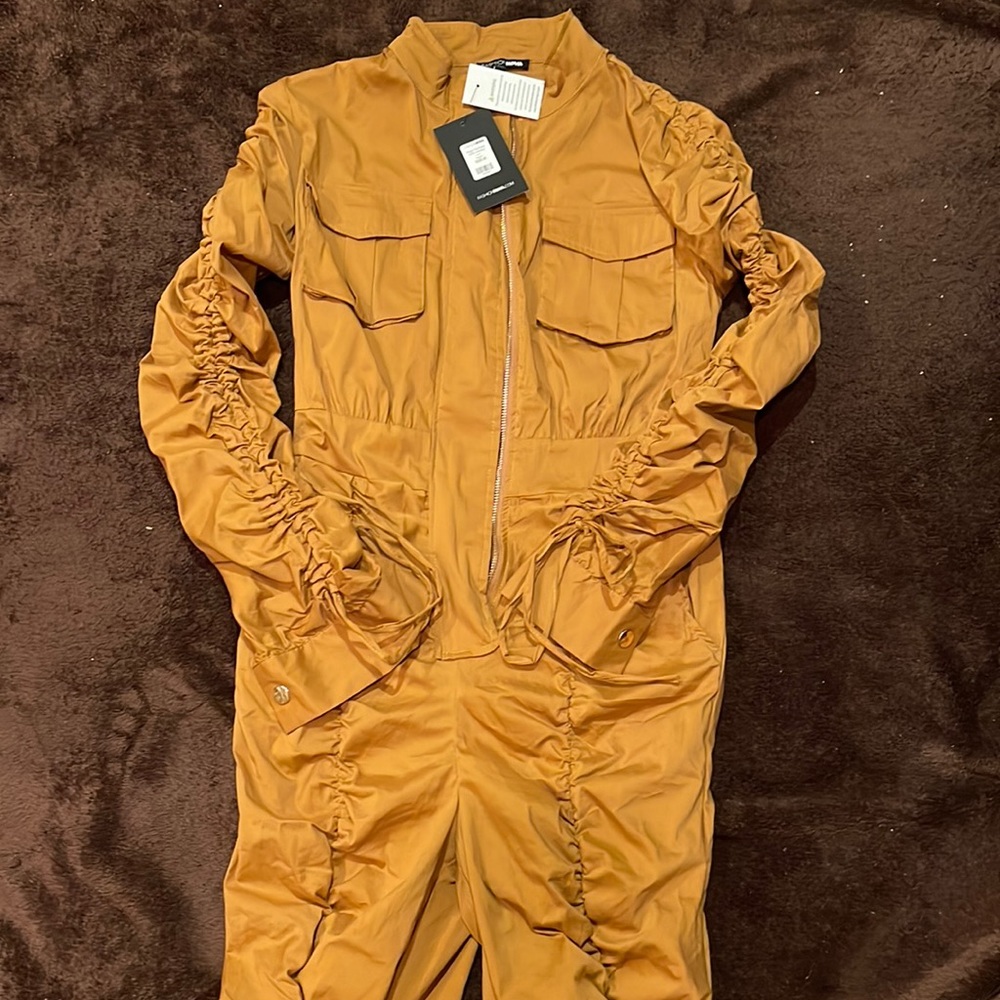 Caramel colored cotton fitted zipper front jumpsuit. New with tags.